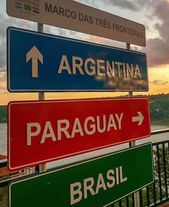 A signpost at the triple bored in Foz da Iguacu in Brazil